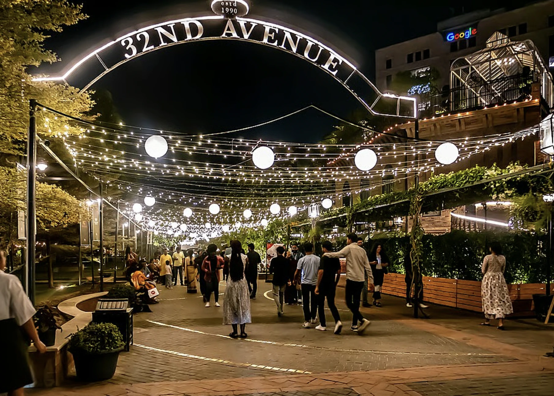 32nd Avenue entrance illuminated at night
